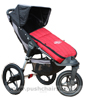 Baby Jogger Summit ATP front wheel in swivel mode, with Red Footmuff - click for larger image